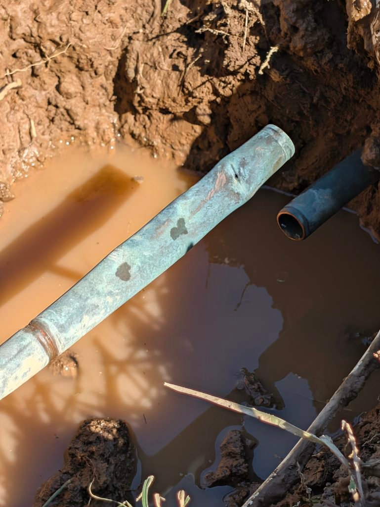 Excavation to repair underground copper water line damage