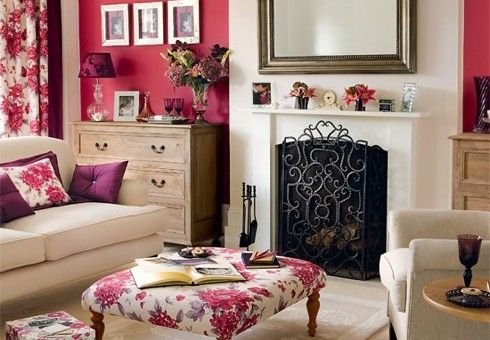 Living room featuring a bold painted accent wall framing a fireplace