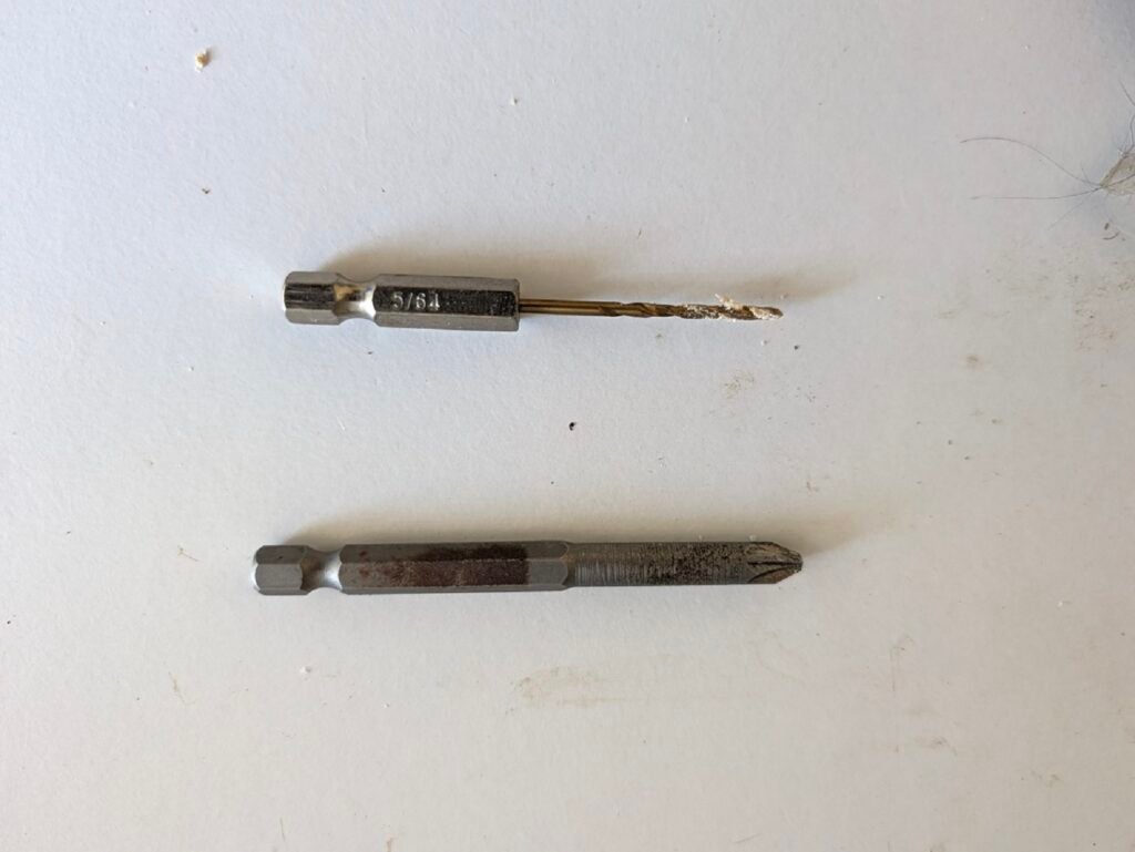5/64 inch drill bit and number 2 Phillips driver bit used for mounting screen door hardware