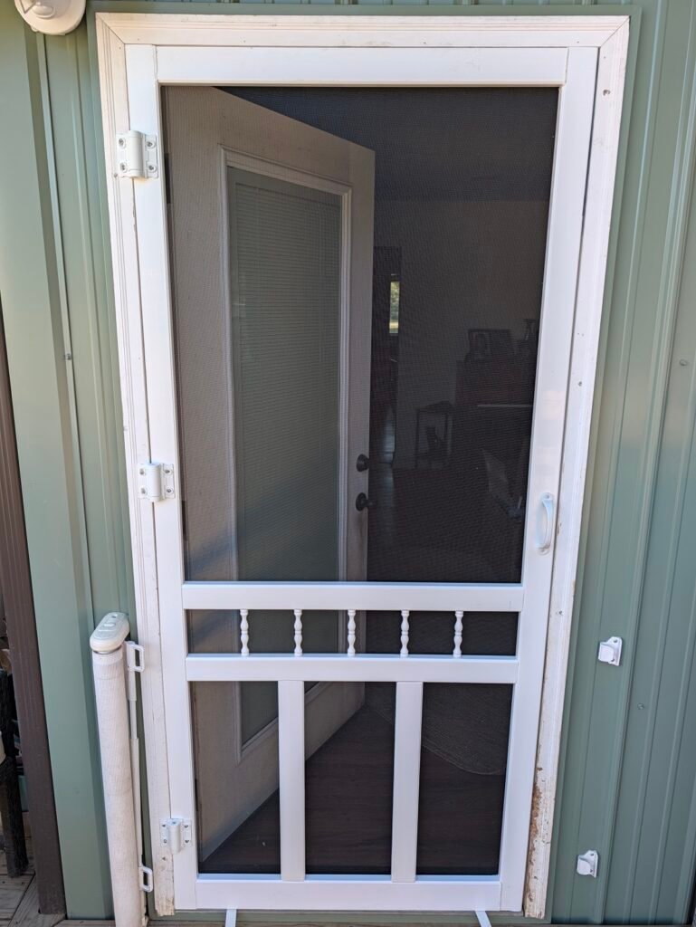 Completed project showing how to hang a vinyl screen door