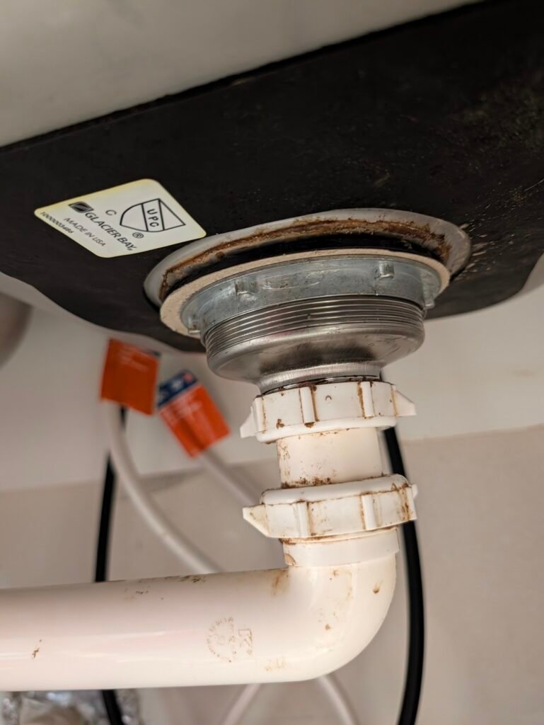 How to replace a kitchen sink basket strainer with metal locknut and connected P-trap