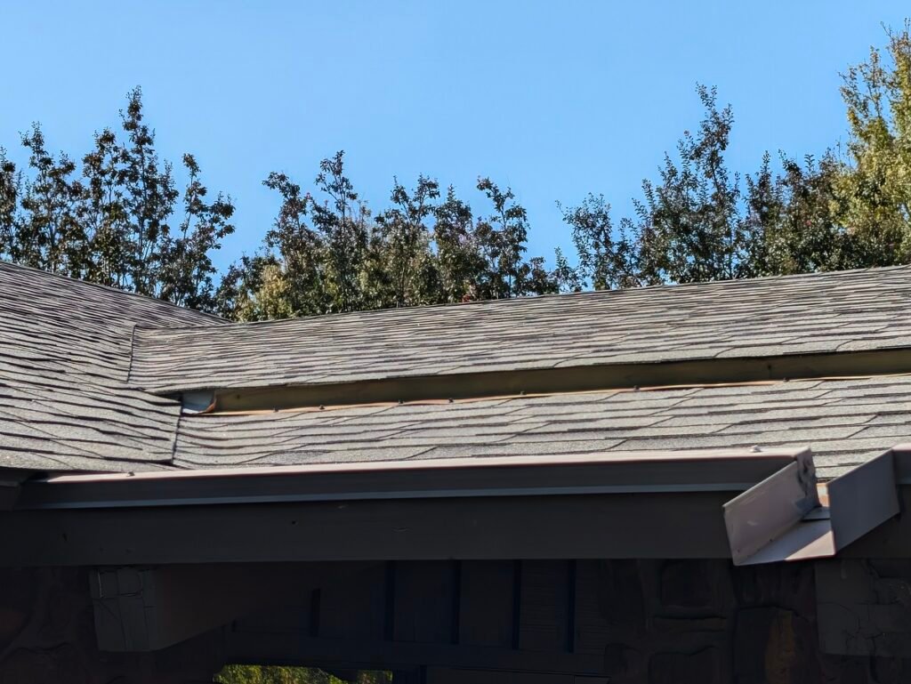 inspecting roof flashing gutter cleanout and eave drainage