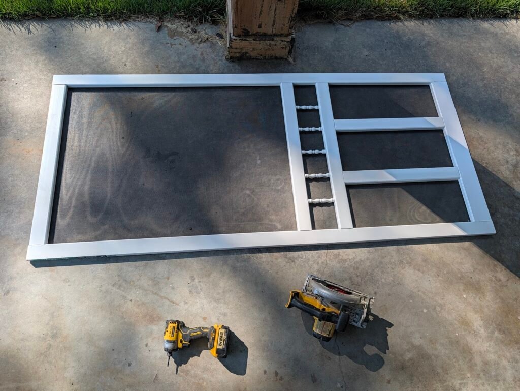 Trimming a solid vinyl screen door on concrete using a cordless circular saw